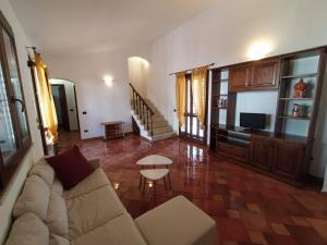 a living room with a couch and a table at SanVitoTour- Residence Il Baglio in San Vito lo Capo