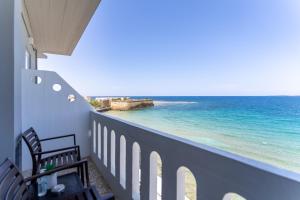 a balcony with a view of the ocean at Kumba At Koum Kapi in Chania Town