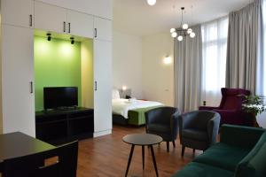 TV a/nebo společenská místnost v ubytování Osten Art Hotel