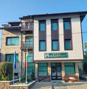 a building with a sign that reads hotel edinburgh at HOTEL GOLDEN CITY in Zlatograd