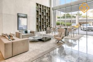 a living room with a couch and chairs and a table at Keysplease Spectacular Views Modern 1BR Creek Gate 602 in Dubai
