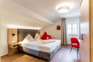 Voodi või voodid majutusasutuse Hotel Rosenvilla toas