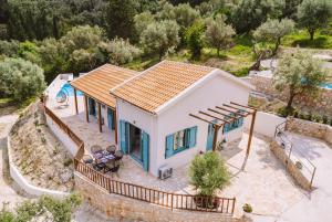 an aerial view of a house with a pool at Meliades villas in Apolpaina