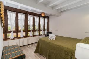 Postel nebo postele na pokoji v ubytování CASA GERRA COMILLAS