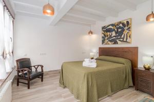 Postel nebo postele na pokoji v ubytování CASA GERRA COMILLAS
