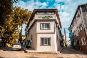a small building with a sign on the side of it at MiLAROOM in Edirne