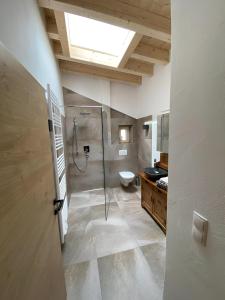 a bathroom with a shower and a toilet in it at apart lobenwein in Pfunds +100 photos