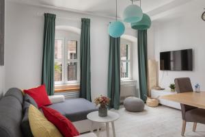 a living room with a couch and a table at Apartment Coastal Villa Makarska in Makarska