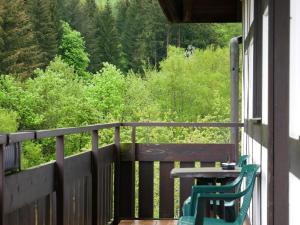 a table and chairs on a porch with a view of trees at Seebach-Hotel in Seebach