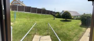 a view from a window of a yard at Idyllic holiday near Abersoch in Mynytho