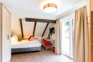 Voodi või voodid majutusasutuse Hotel Rosenvilla toas