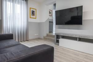 TV a/nebo společenská místnost v ubytování PETIT casa vacanze + 32 fotografií