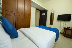Postel nebo postele na pokoji v ubytování High Point Serviced Apartment