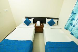 Postel nebo postele na pokoji v ubytování High Point Serviced Apartment