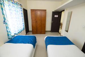 Postel nebo postele na pokoji v ubytování High Point Serviced Apartment