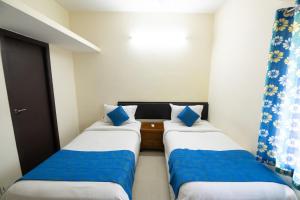 Postel nebo postele na pokoji v ubytování High Point Serviced Apartment