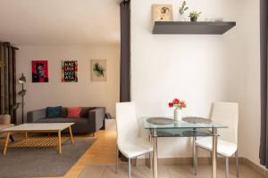 a living room with a table and chairs and a couch at APT Wit Free Secure Parking in Budapest