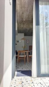 a room with a table and a dining room at CASA dos MIÑOS in Cangas de Morrazo