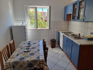 Kuchyň nebo kuchyňský kout v ubytování Apartments HARMONY Novalja