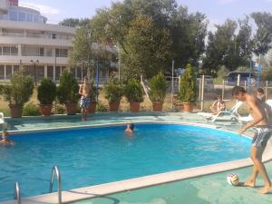 a group of people in a swimming pool at Hotel Zora in Kranevo