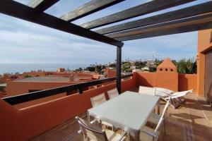 Balkon lub taras w obiekcie Jardines de Nueva Galera