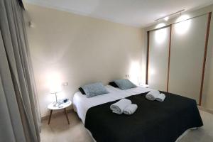 Łóżko lub łóżka w pokoju w obiekcie Jardines de Nueva Galera