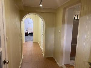 a hallway with an archway in a house at Guest House Vilnius in Vilnius