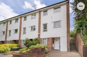a large white building with a brick at Home in Medway 3bedroom free sports channel, parking in Chatham