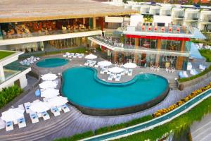 an aerial view of a resort with a swimming pool at Sheraton Bali Kuta Resort in Kuta