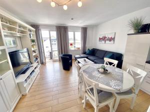 TV a/nebo společenská místnost v ubytování Wohnpark Stadt Hamburg - Apt. 50