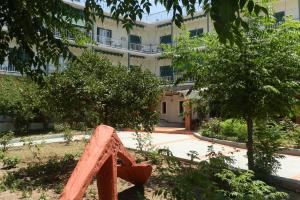 a statue in front of a building at Ancora Hotel in Poros