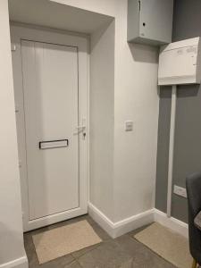 a white door in the corner of a room at 5 Eyre Square Lane in Galway