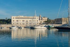 a group of boats are docked in a harbor at San Paolo Al Convento in Trani