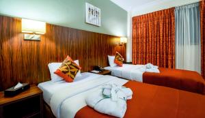 Alisa Hotel North Ridge客房内的一张或多张床位