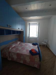 Posteľ alebo postele v izbe v ubytovaní Casa della Nonna casevacanzeargentario