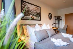 a bedroom with a bed with white pillows at SweetHome - Zentral - Küche & Parkplatz, WiFi in Halle an der Saale