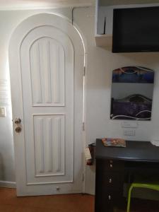 a white door in the corner of a room at The Terrace Room in Manila