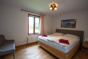 En eller flere senger på et rom på Chalet Lomnica
