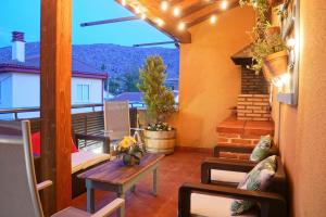 a balcony with a table and chairs and a view at Casas Rurales Florentino in Robledillo