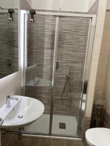 a bathroom with a shower and a sink at Bevagna VILLA DEL COLLE CAMERA MERLOT in Bevagna +16 photos