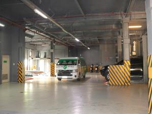 a garage with a white van parked in it at Go Hotels Manila Airport Road in Manila