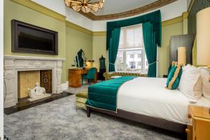 a bedroom with a bed and a fireplace at Number 31 in Dublin