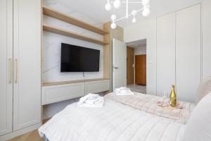 Posteľ alebo postele v izbe v ubytovaní Wyspa Solna Kołobrzeg by Renters Prestige