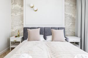 Posteľ alebo postele v izbe v ubytovaní Wyspa Solna Kołobrzeg by Renters Prestige