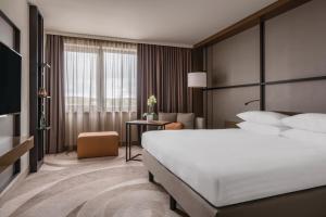 Postel nebo postele na pokoji v ubytování Stuttgart Marriott Hotel Sindelfingen