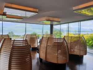 a row of chairs in a room with windows at The Europe Hotel & Resort in Killarney