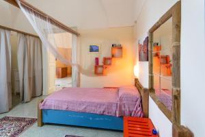 A bed or beds in a room at Casa vacanza Enea con idromassaggio - Apulia Home