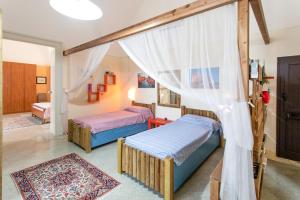 A bed or beds in a room at Casa vacanza Enea con idromassaggio - Apulia Home