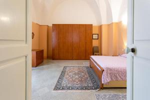 A bed or beds in a room at Casa vacanza Enea con idromassaggio - Apulia Home