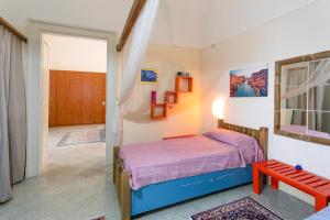 A bed or beds in a room at Casa vacanza Enea con idromassaggio - Apulia Home